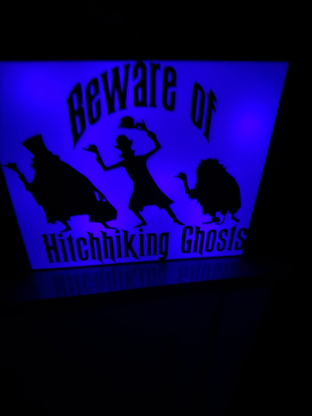Beware of Ghosts Lightbox — the same lightbox shown lit from within, its cut-out panel glowing.