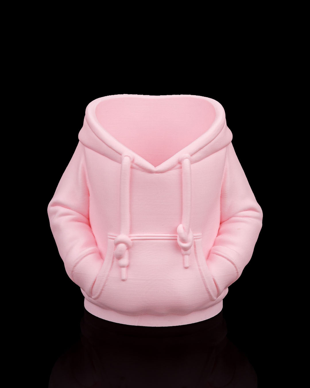 Hoodie Can Holder — the same holder printed in pale pink, shown empty.