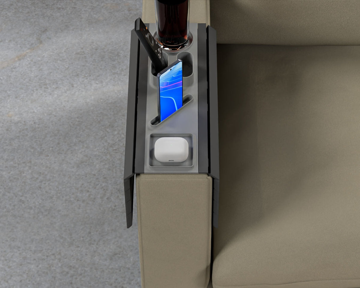 All In — Modular Sofa Side Table — the tray on an olive sofa arm with a drink, an upright phone and an earbuds case.