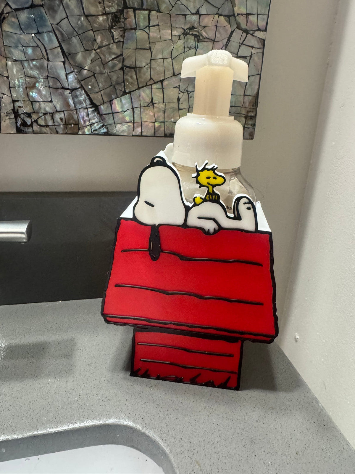 Beagle & Doghouse Soap Dispenser Holder — a red doghouse shaped holder with a white roof, sized to hold a foaming soap bottle at a sink.