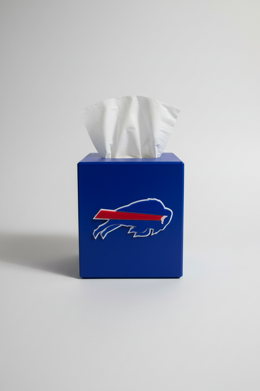 Buffalo Football Tissue Box Cover — a blue square tissue box cover with a raised front emblem, tissue drawn through the top, on a soft light-gray studio background.