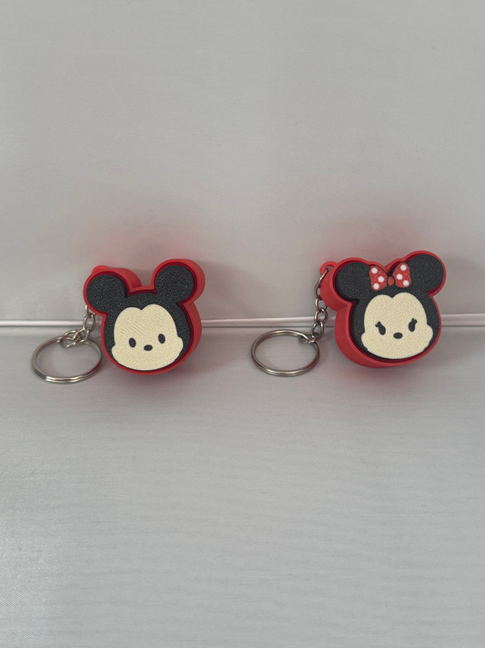 Character Head Fidget Clickers — small round fidget clickers with rounded ear silhouettes, shown in several colours.
