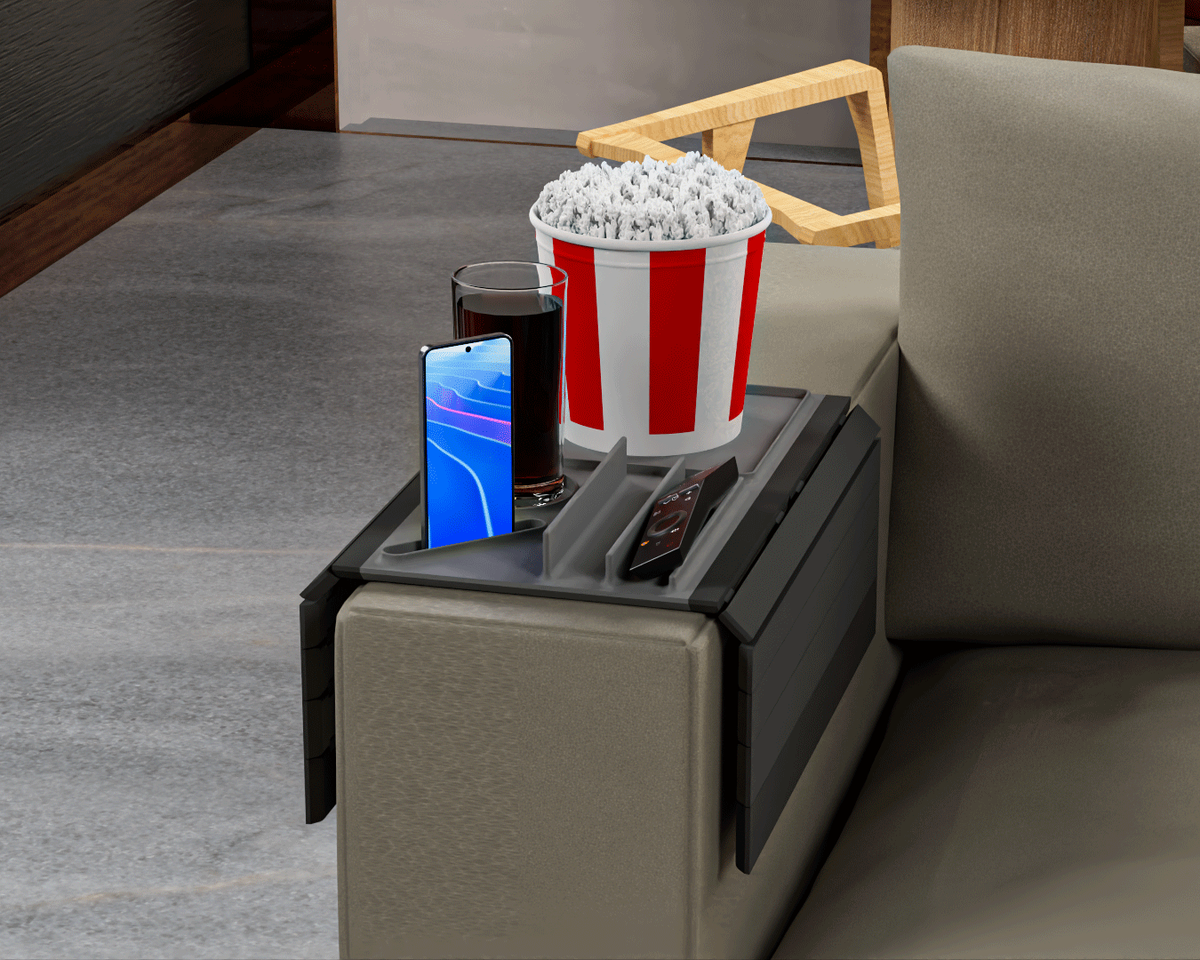 Couch Buster — Modular Sofa Side Table — the tray on an olive sofa arm with popcorn, a drink, a phone and a remote.