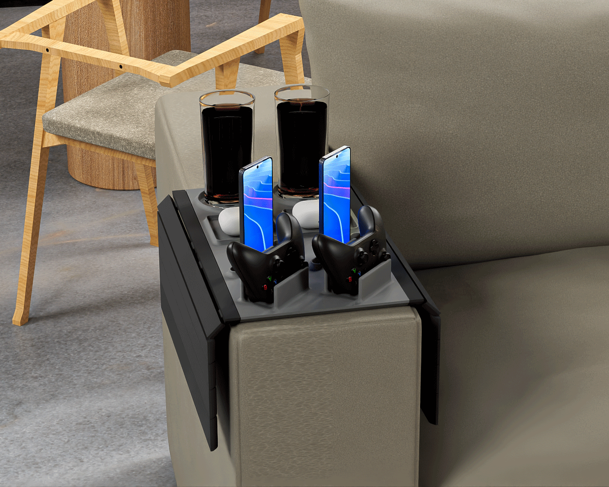 Couch Co-Op — Modular Sofa Side Table — the two-player layout on an olive sofa arm, a wooden chair behind.