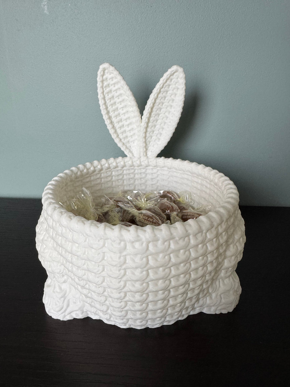 Easter Bunny Bowl — a white basket-weave textured bowl with two upright bunny ears, filled with wrapped sweets.