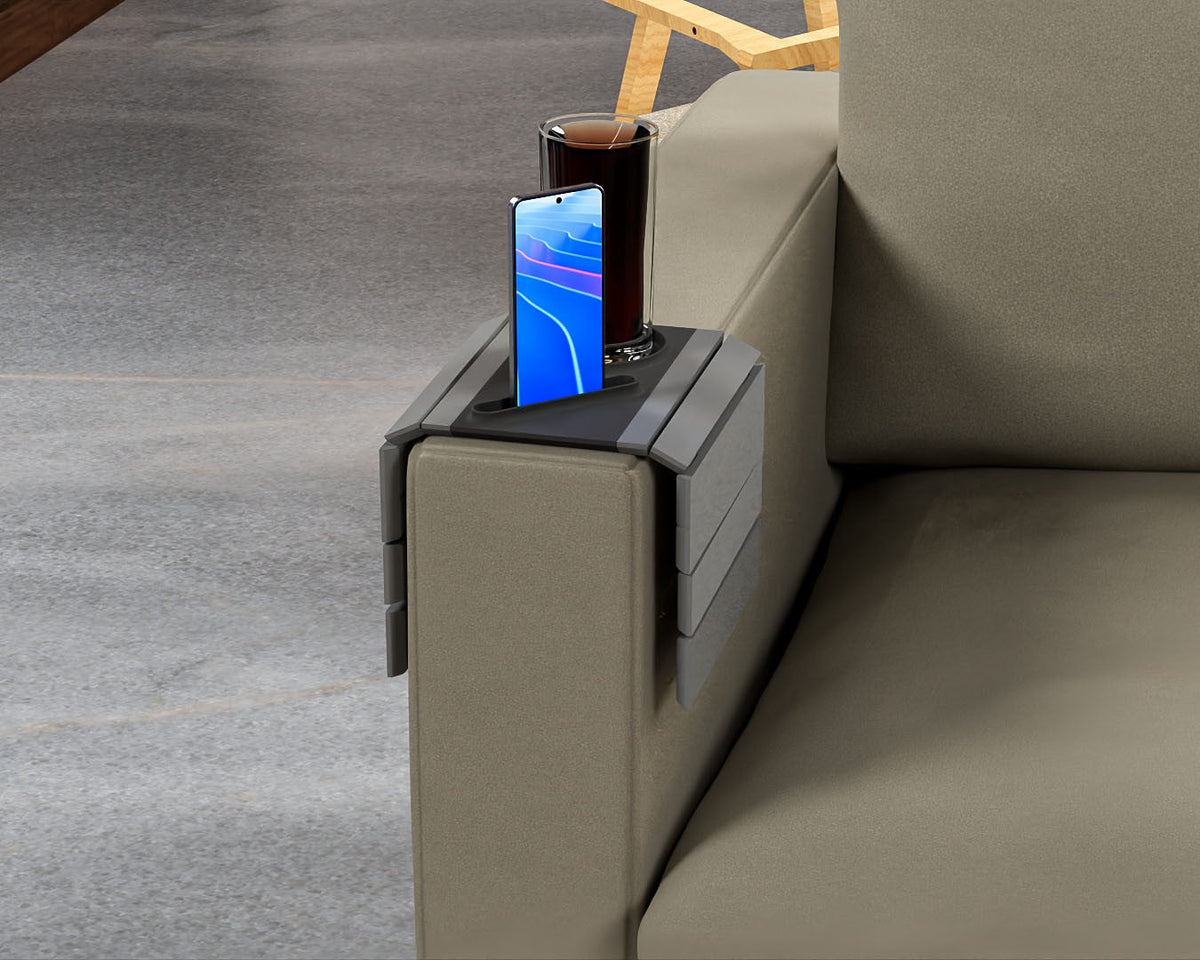 First Stop — Modular Sofa Side Table — the tray seen along the sofa arm, holding a drink and a phone.