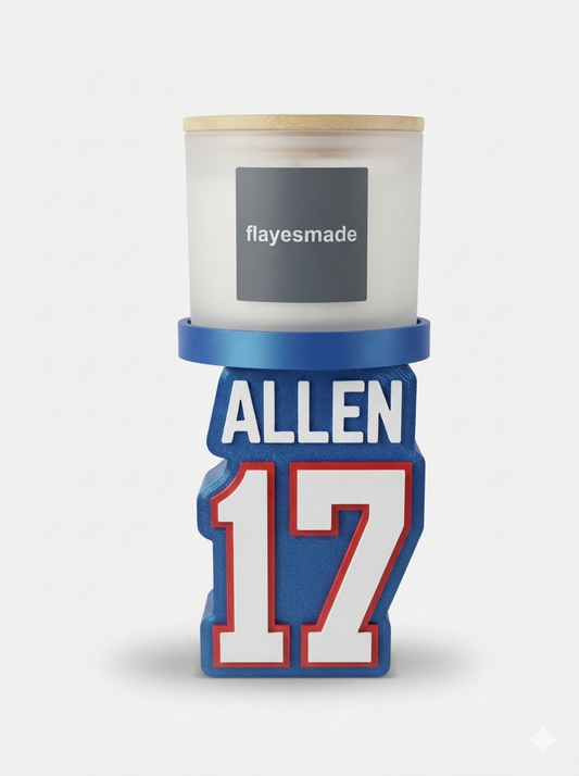 Football Jersey Candle Holder — Buffalo Colors — royal blue jersey-shaped stand with raised white and red lettering and numbering, topped with a blue collar ring holding a lidded frosted-white jar candle, on a soft light-gray studio background.