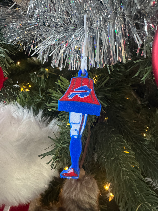 Football Leg Lamp Ornament — a flat layered ornament shaped like a lamp with a stockinged leg, in team colours, with a hanging loop.