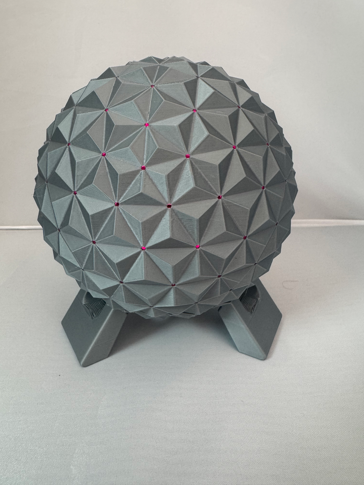 Geodesic Sphere Lamp with RGB Lights — the same lamp with the facet points lit pink.