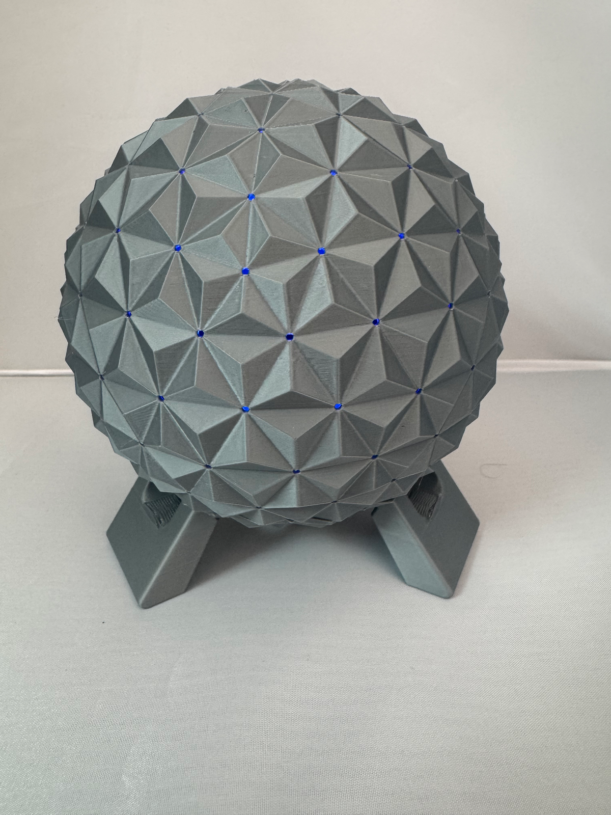 Geodesic Sphere Lamp with RGB Lights — the same lamp with the facet points lit blue.