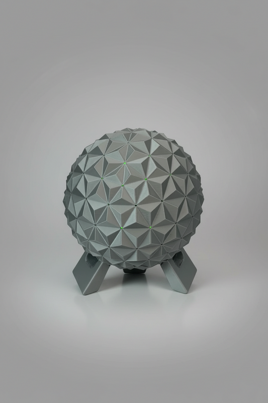 Geodesic Sphere Lamp with RGB Lights — a gray 3D-printed geodesic sphere lamp on a matching geometric stand, on a soft light-gray studio background.