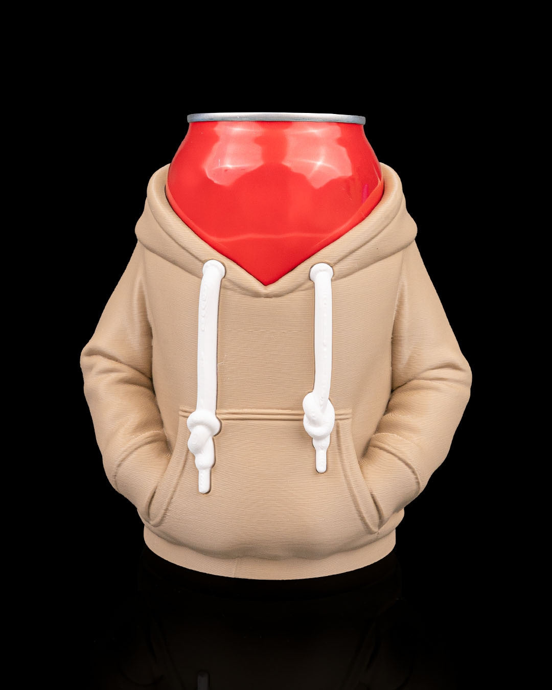 Hoodie Can Holder — a tan hoodie-shaped can holder with a drawstring hood and front pocket, holding a red can, front view.