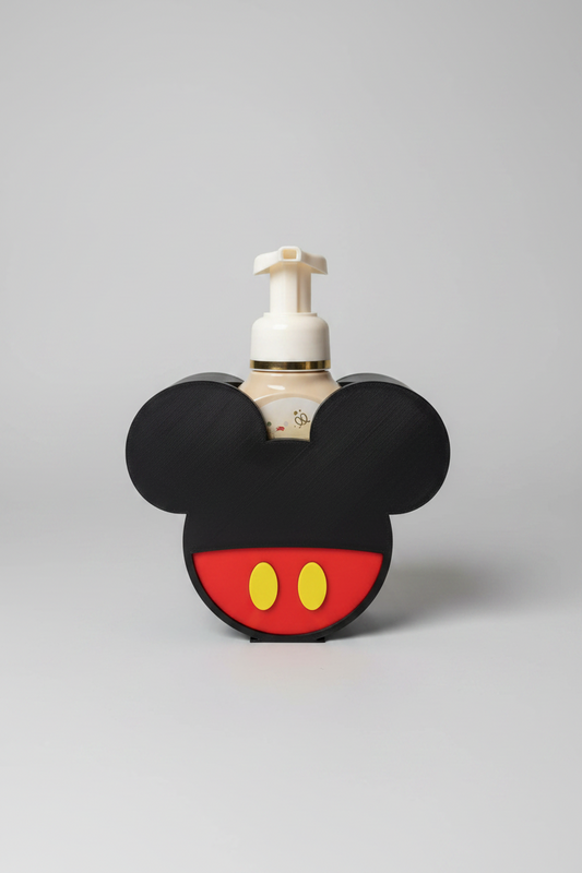 Mouse Head Soap Dispenser Holder — a black mouse-head-shaped soap dispenser holder cradling a pump bottle, on a soft light-gray studio background.