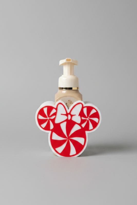 Peppermint Candy Soap Dispenser Holder (With Bow) — a festive red and white mouse-shaped pump bottle holder featuring candy cane swirls and a bow, on a soft light-gray studio background.