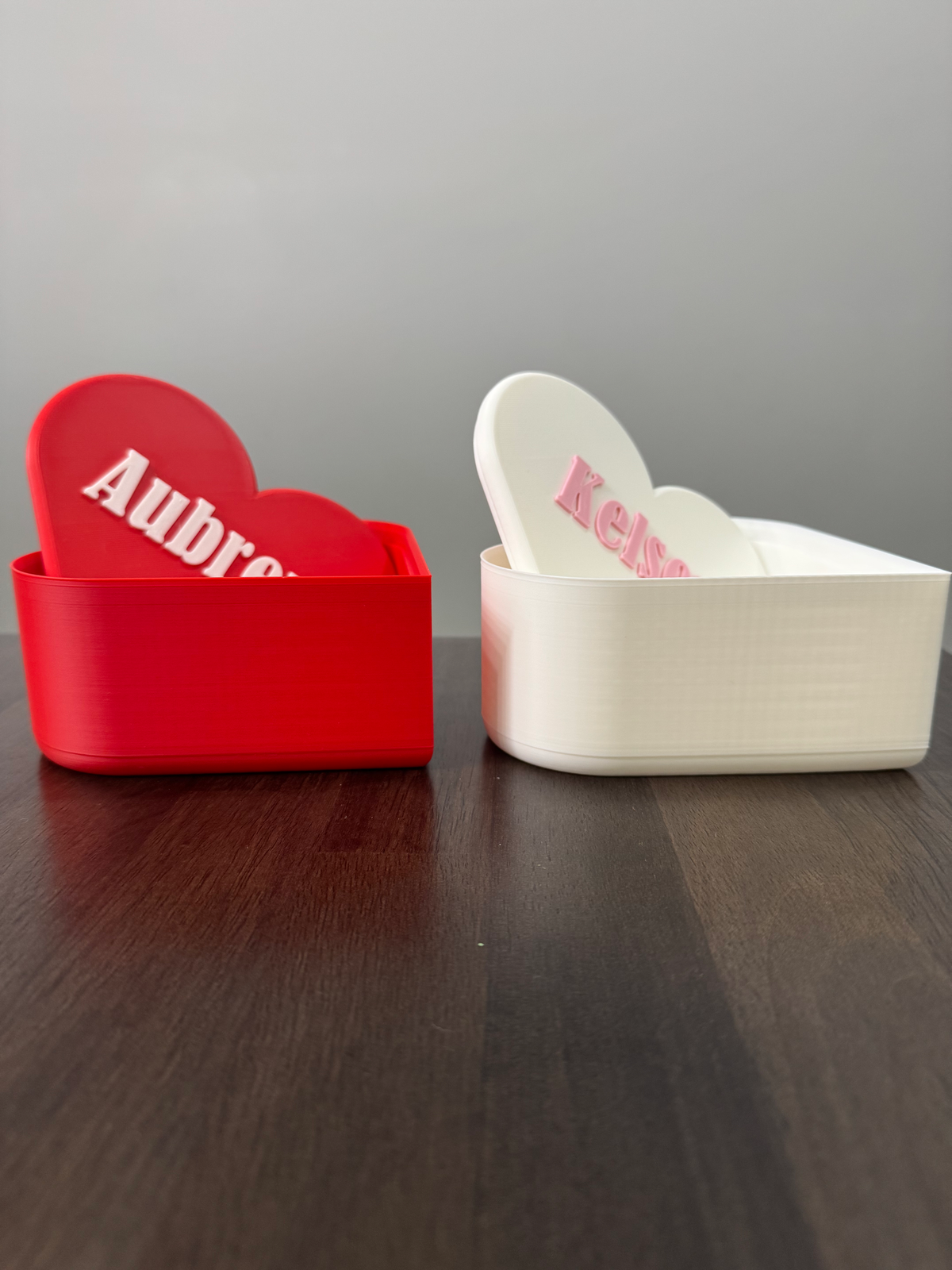 Personalized Heart Keepsake Box — the red and white heart boxes shown open with their personalized lids resting inside.