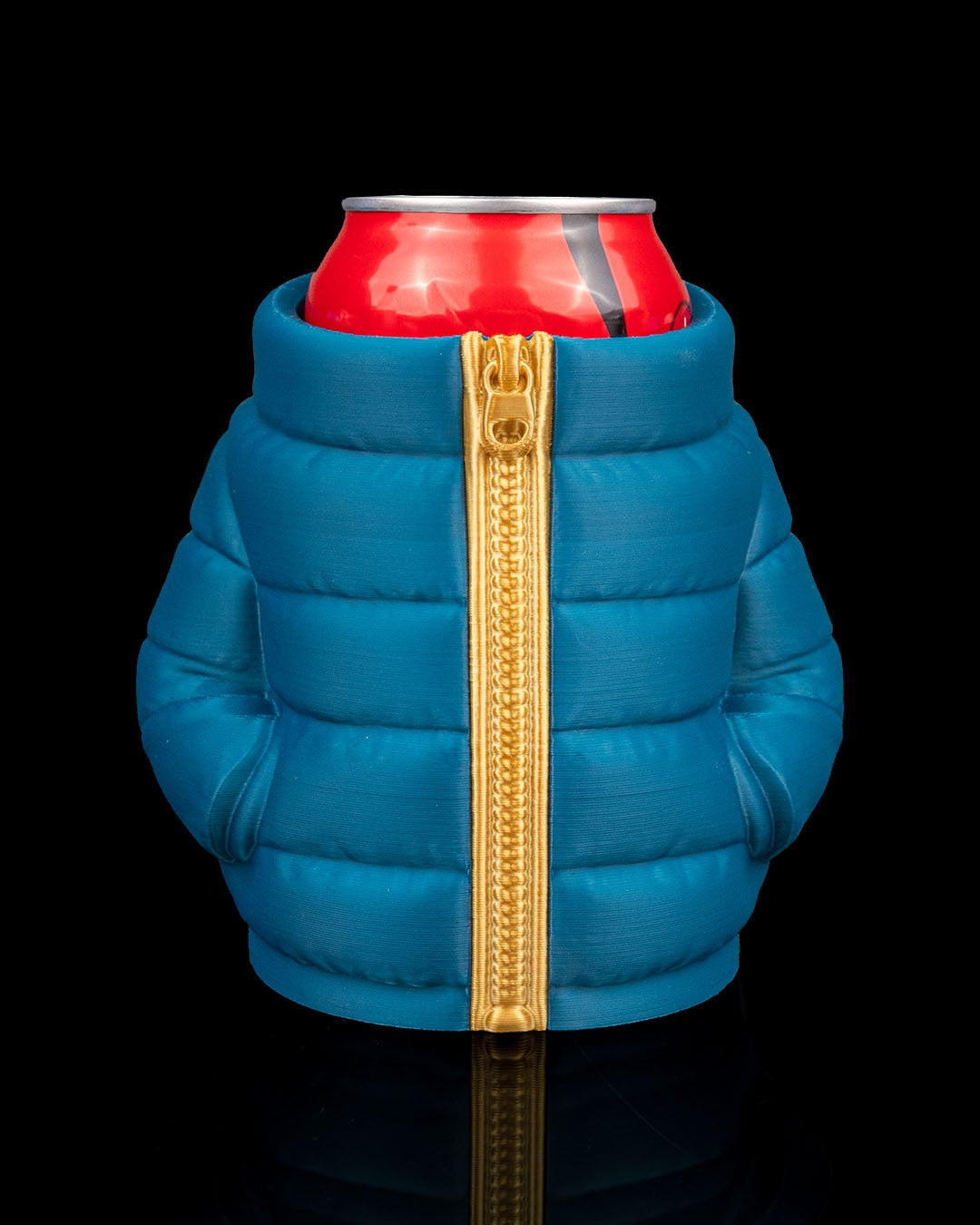 Puffer Jacket Can Holder — close front view of the teal quilted can sleeve with its gold zipper and puffed panels around a red can.