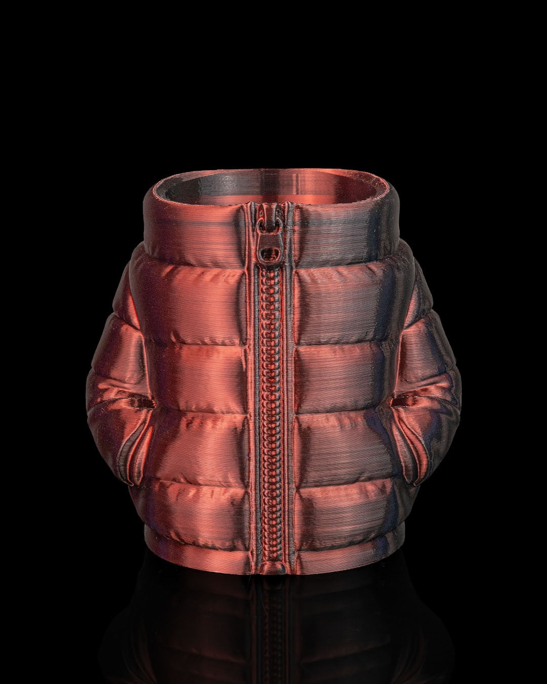 Puffer Jacket Can Holder in copper — a metallic copper quilted puffer can sleeve with a matching zipper front.
