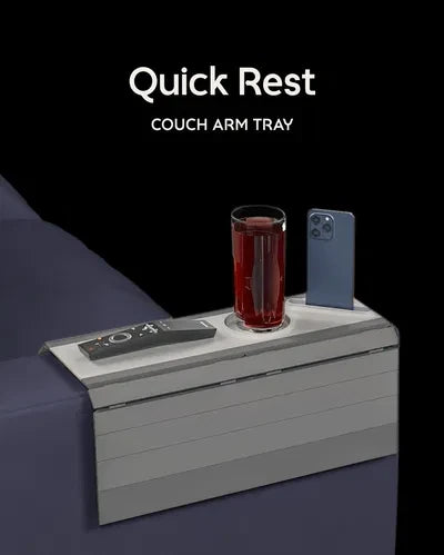 Quick Rest Modular Sofa Side Table — a grey slatted couch arm tray with a cup holder, phone slot and remote, holding a drink and a phone.