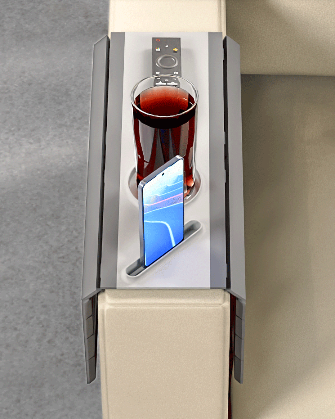 Quick Rest Modular Sofa Side Table — overhead view showing the cup holder with a glass, the phone slot and the remote slot.