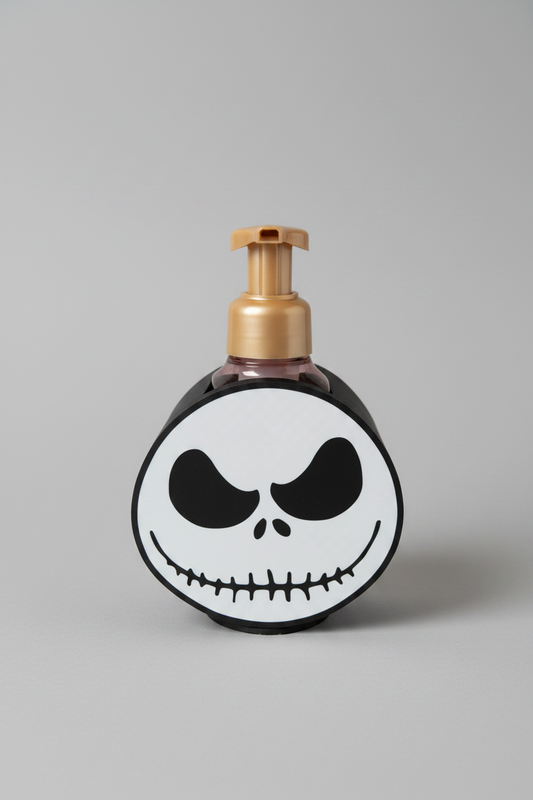 Skeleton Face Soap Dispenser Holder — a round black and white holder with a printed face design, sized for a foaming soap bottle, on a soft light-gray studio background.