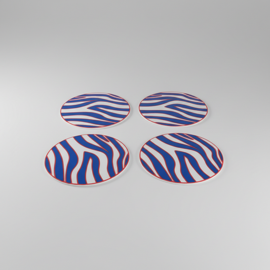 Zigzag Stripe Coaster Set — Buffalo — four round coasters with a blue and white zigzag stripe pattern and red borders, arranged in a 2x2 grid, on a soft light-gray studio background.